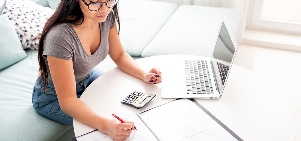 The College Search: Find the Right College for Both Academic and Financial Benefits, image of a woman doing her finances at a laptop after divorce